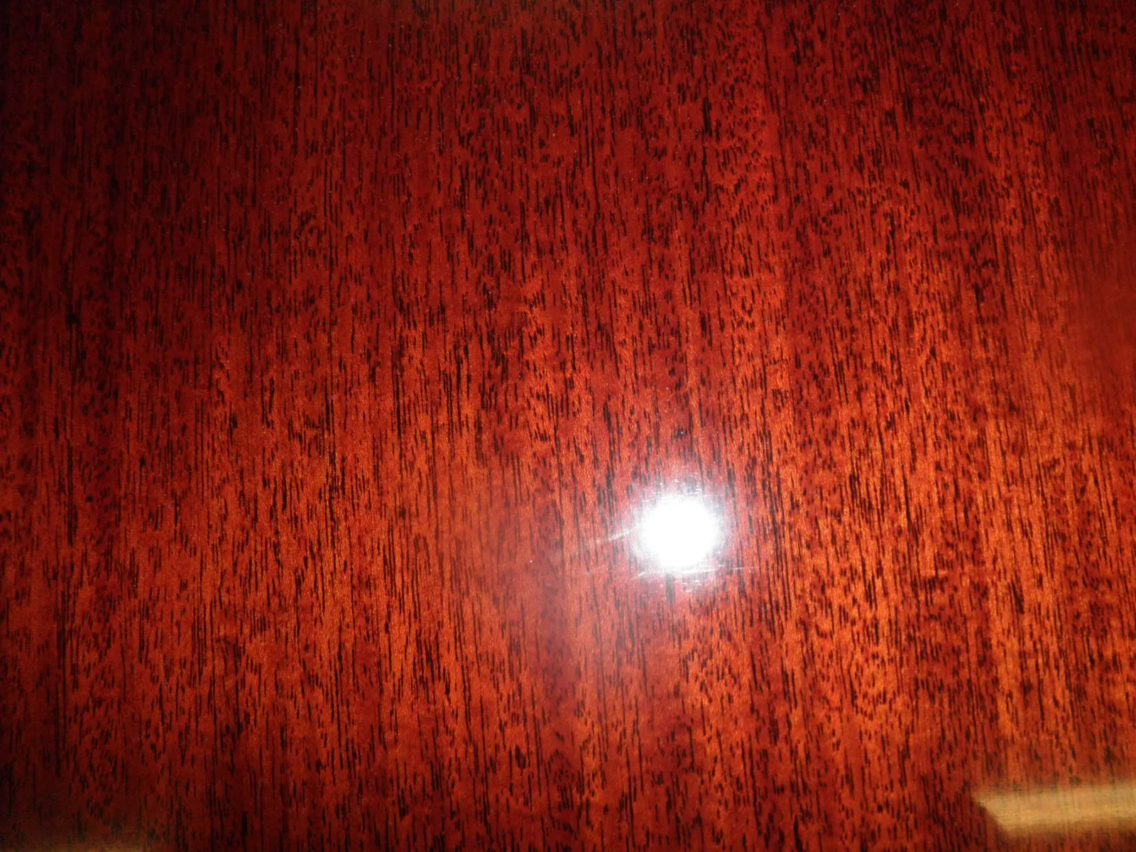 Piano finish dining table after chandelier damage repair by Olek Inc.