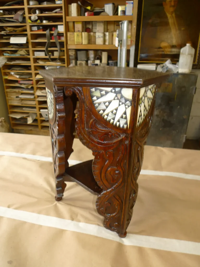 Middle Eastern carved and inlaid lamp table after restoration by Olek Inc.